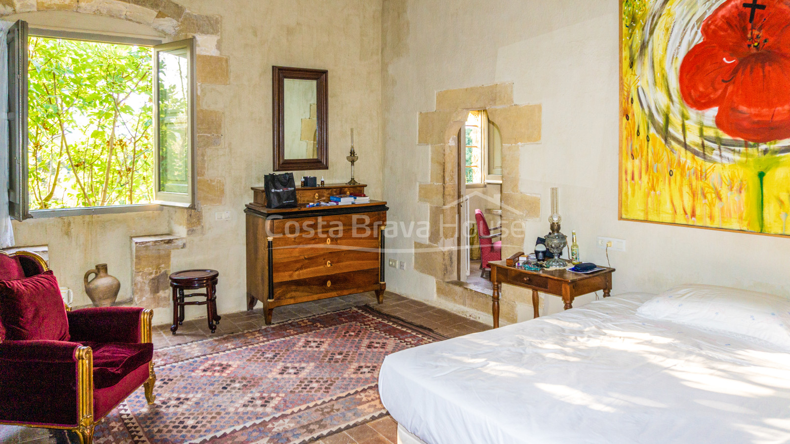 Renovated Catalan masia for sale in Cruilles with 12.000 m² of land and lovely garden with pool