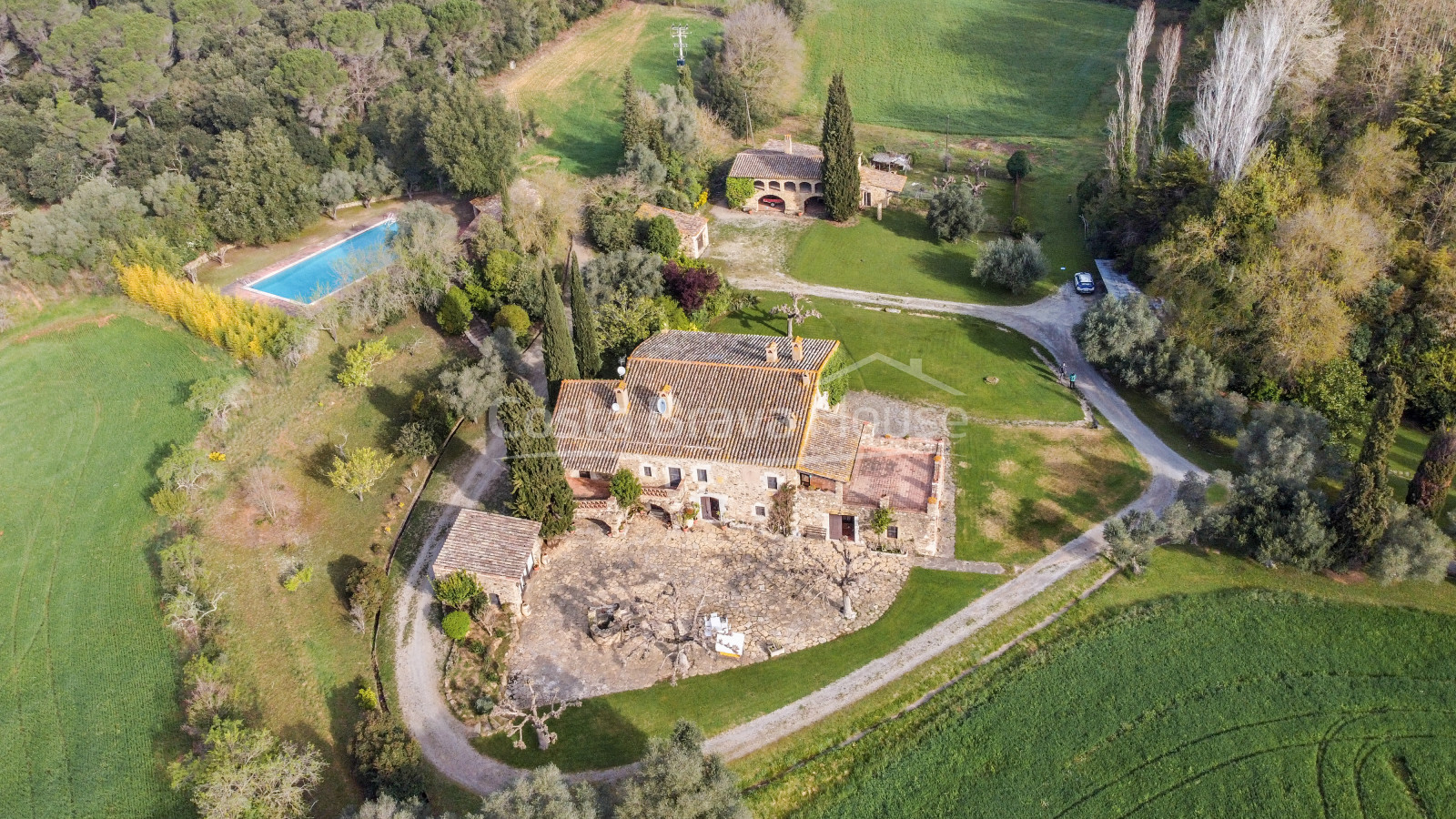 Stately 17th century Catalan country house for sale in Cruilles with 19 ha of land and outbuildings