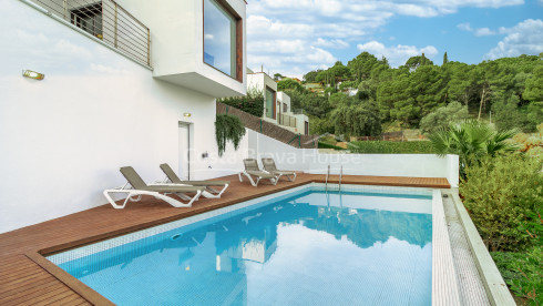 Contemporary house in Sa Riera with sea views, stepped terraces and private pool